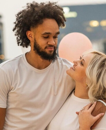 Derrick White with his wife.